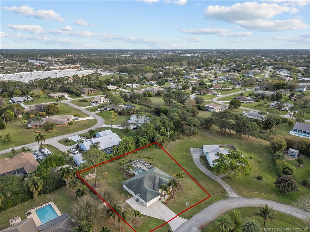 2457 Southeast Issac Road Port St. Lucie, FL 34952 - Photo 36 of 51 an aerial view of a city with mountains