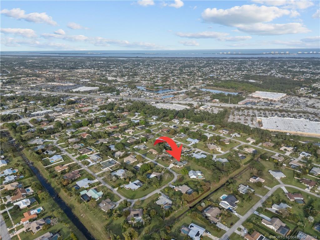 2457 Southeast Issac Road Port St. Lucie, FL 34952 - Photo 38 of 51 an aerial view of residential houses with outdoor space