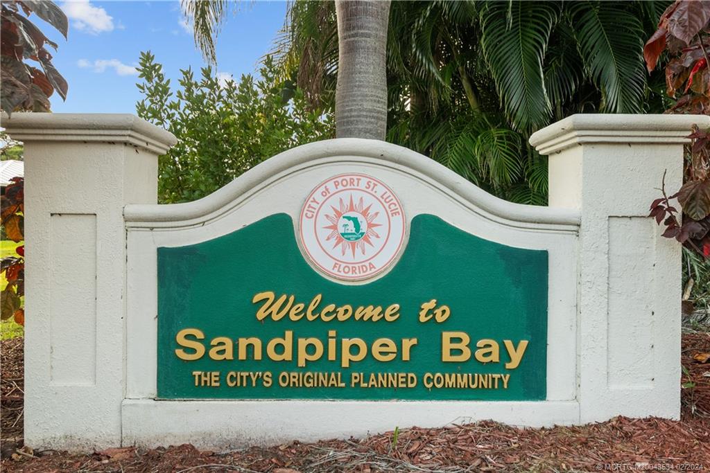 2457 Southeast Issac Road Port St. Lucie, FL 34952 - Photo 50 of 51 a sign that is on the side of a building