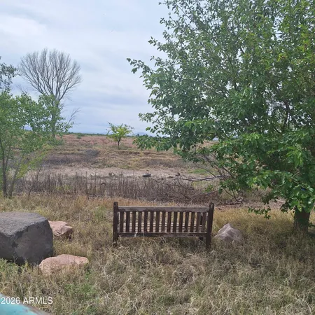 a view of a bench in a yard