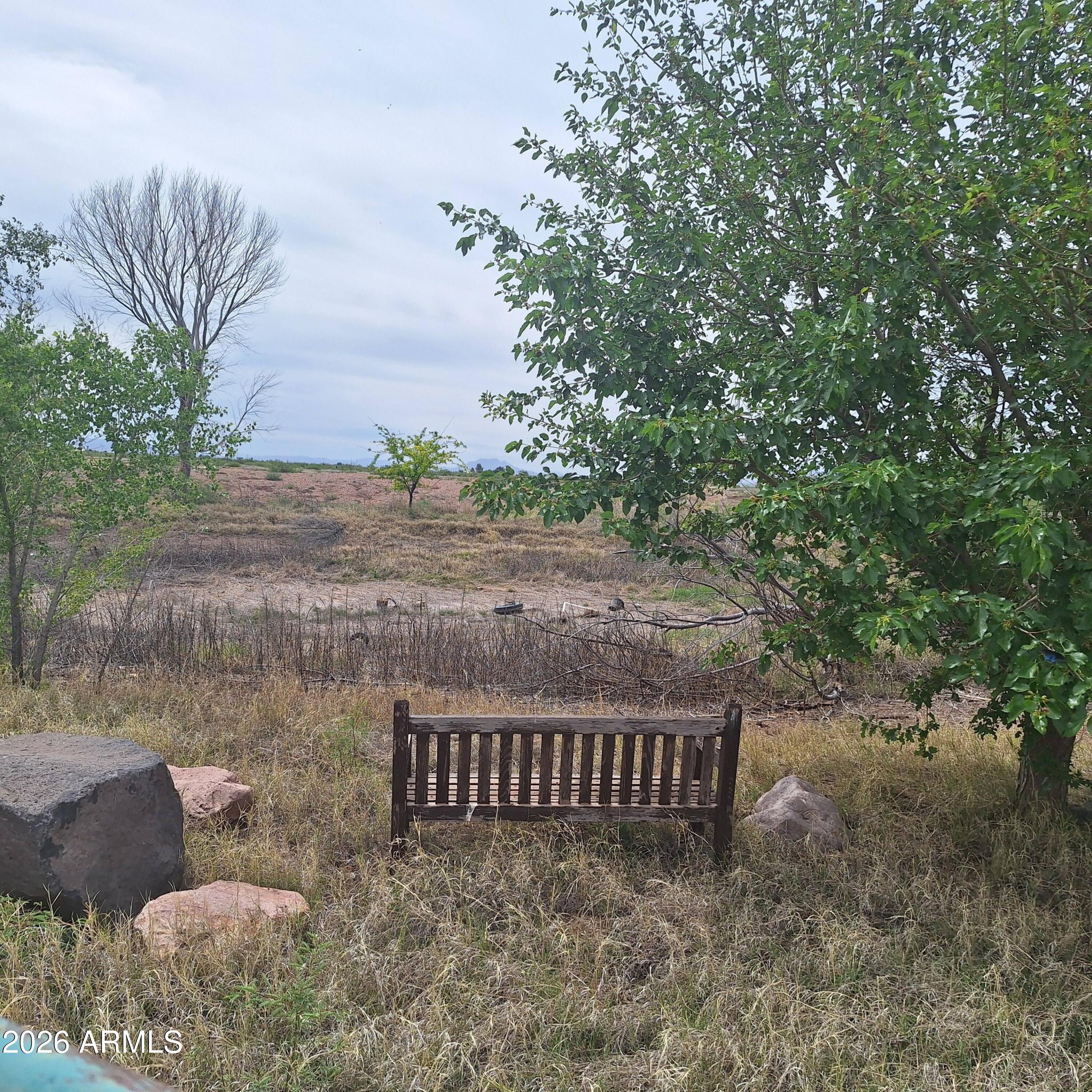 3470 West Double Adobe Road McNeal, AZ 85617 - Photo 1 of 23 a view of a bench in a yard