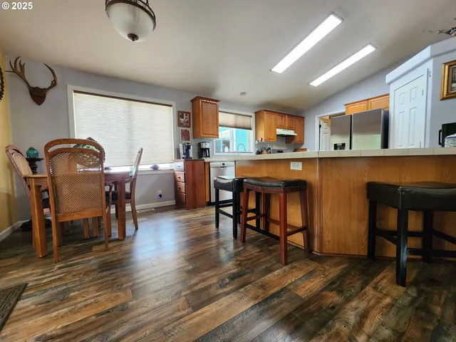 a dining room with furniture and window