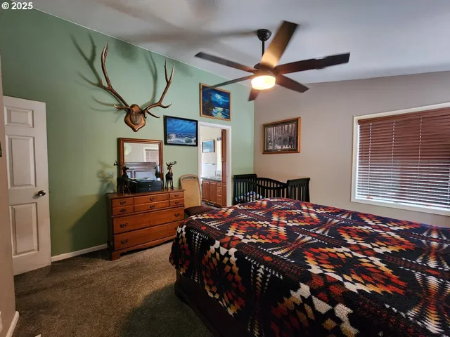 a bedroom with a bed and a mirror