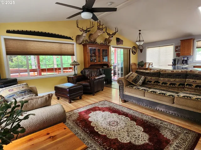 a living room with furniture fireplace and a table