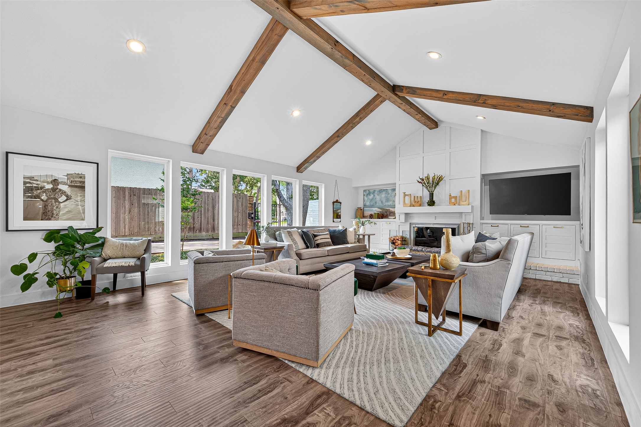 415 Ramblewood Road Houston, TX 77079 - Photo 1 of 49 Welcome to 415 Ramblewood Drive! Open and airy living room with a wall of windows on both sides and vaulted ceiling!