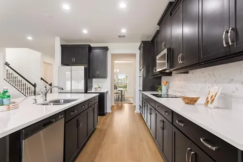 a kitchen with stainless steel appliances granite countertop lots of counter top space