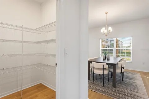 a view of a dining room with furniture and wooden floor