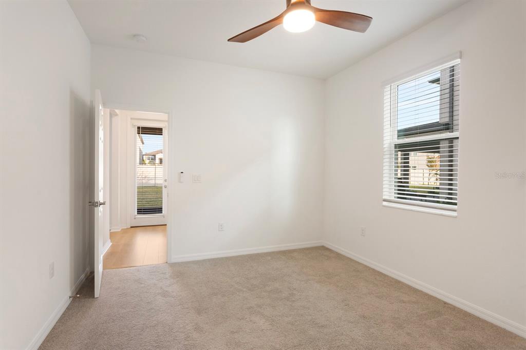 11127 Sundrift Drive Tampa, FL 33647 - Photo 17 of 44 an empty room with windows and closet