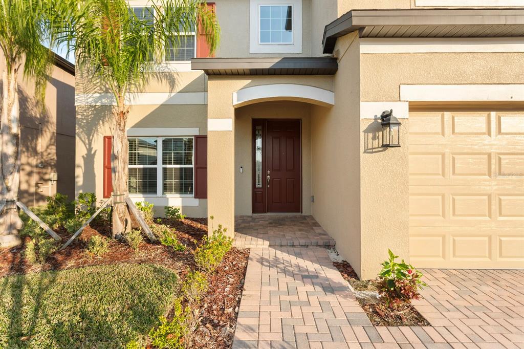 11127 Sundrift Drive Tampa, FL 33647 - Photo 2 of 44 a front view of a house with a yard