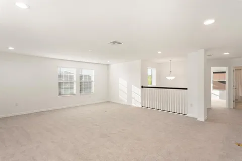 a bed room with a bed and a chandelier