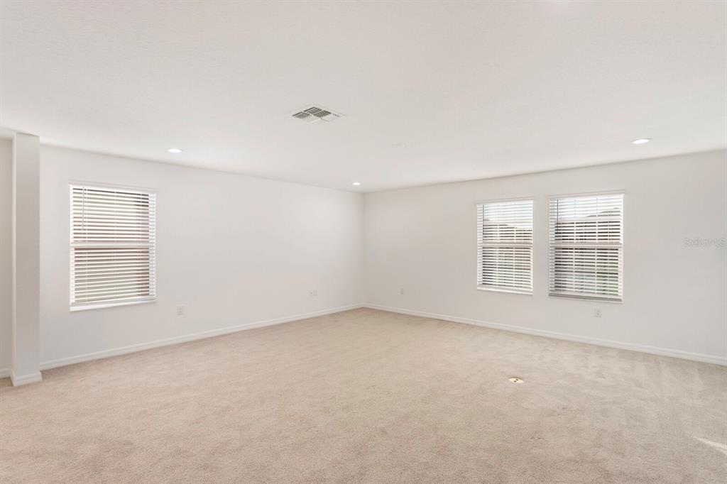 11127 Sundrift Drive Tampa, FL 33647 - Photo 23 of 44 an empty room with a empty space and windows