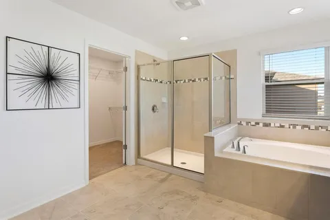 an empty room with closet and a chandelier fan