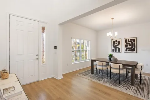 a view of a livingroom with furniture window and wooden floor