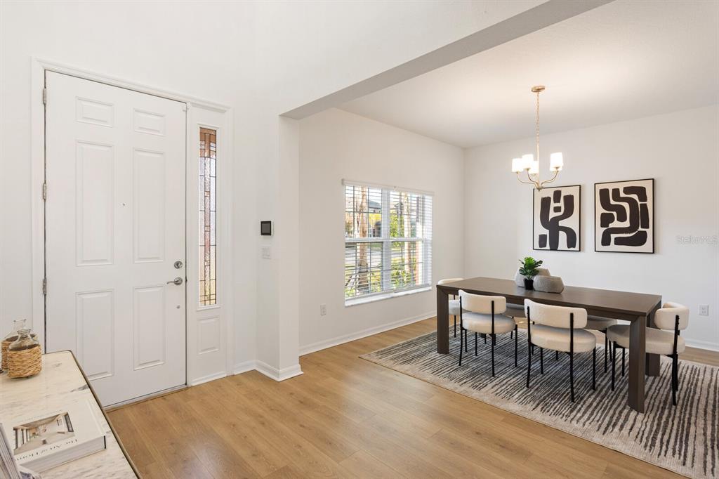 11127 Sundrift Drive Tampa, FL 33647 - Photo 4 of 44 a view of a livingroom with furniture window and wooden floor