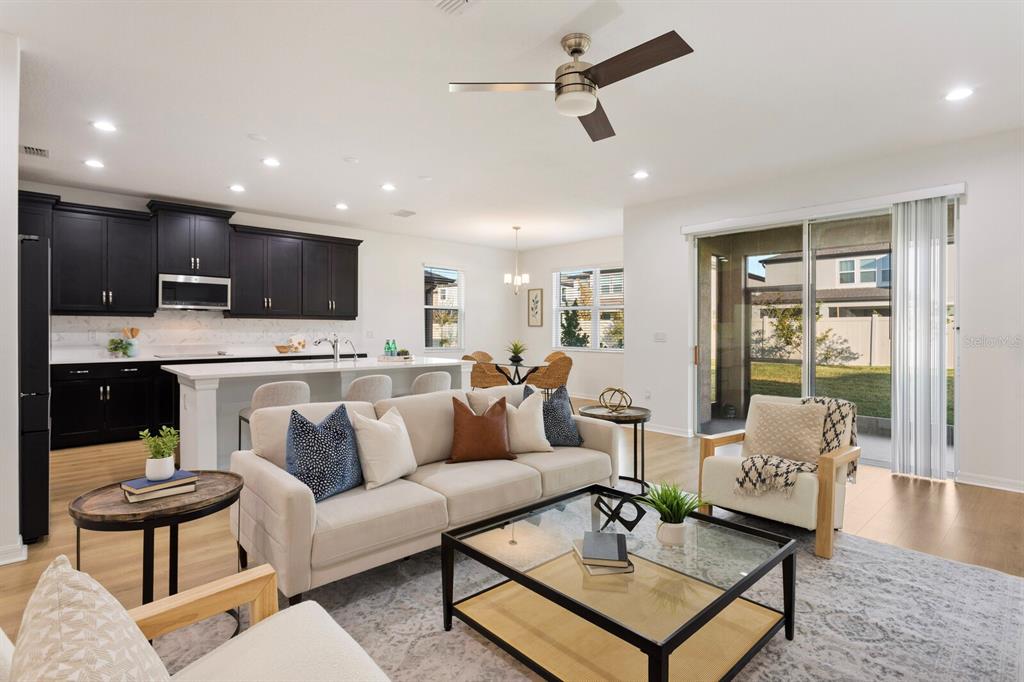 11127 Sundrift Drive Tampa, FL 33647 - Photo 7 of 44 a living room with furniture and a wooden floor