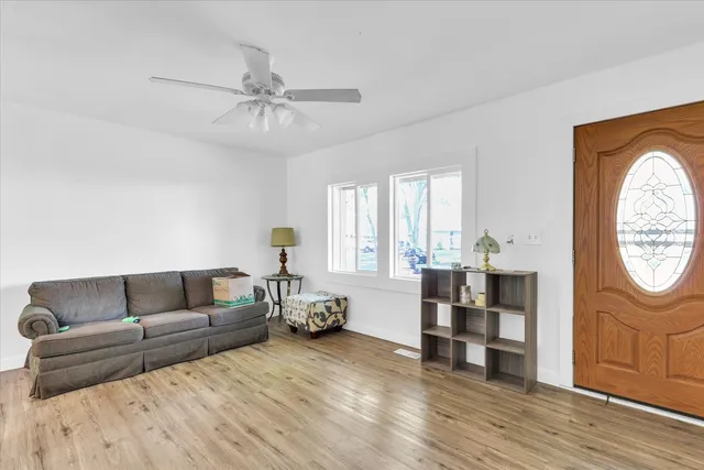 a living room with furniture and a large window