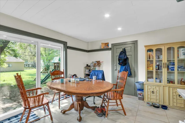a view of a dining room with furniture window and outside view