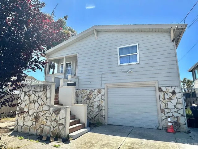 a view of a house with a garage