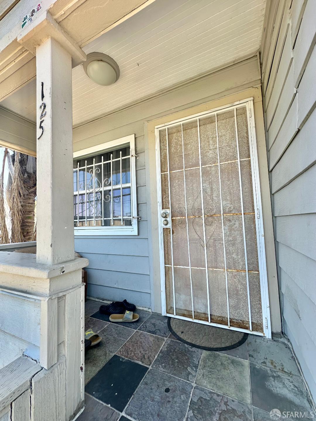 125 7th Street Richmond, CA 94801 - Photo 2 of 11 a front view of a house with a glass door