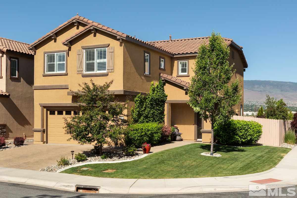 10701 Cordero Drive Reno, NV 89521 - Photo 1 of 25 a front view of a house with a yard