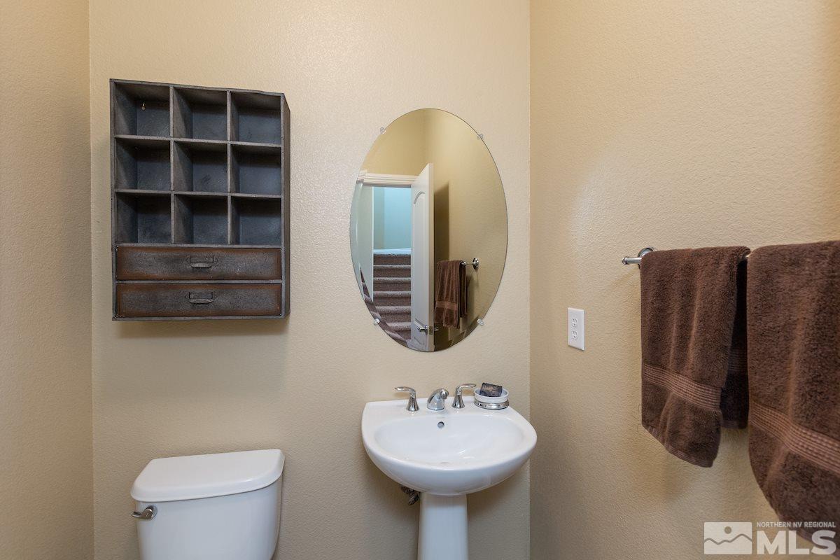 10701 Cordero Drive Reno, NV 89521 - Photo 13 of 25 a bathroom with a sink a toilet and a mirror