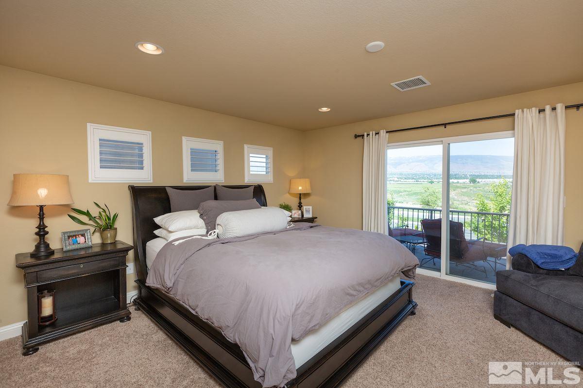 10701 Cordero Drive Reno, NV 89521 - Photo 14 of 25 a bedroom with a bed and window