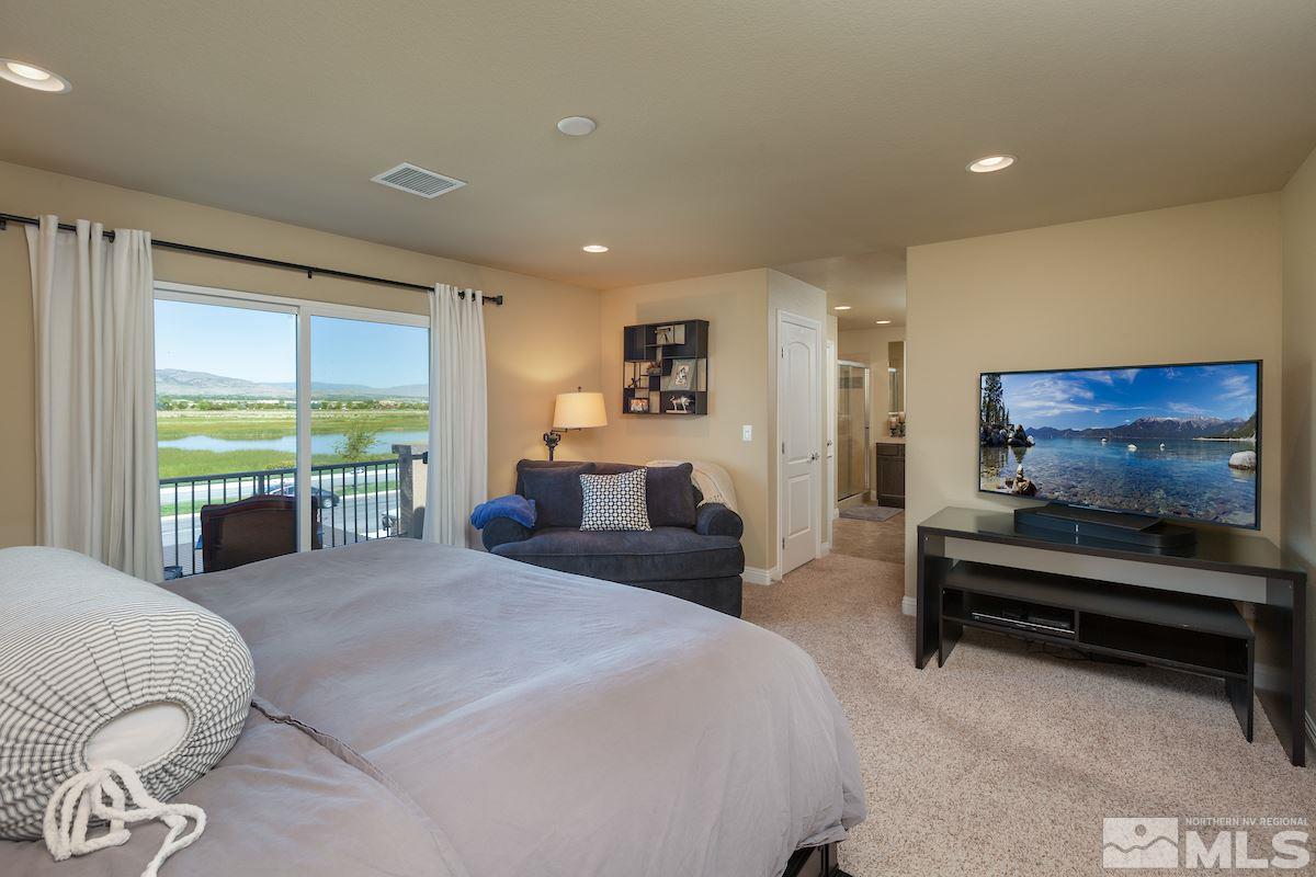 10701 Cordero Drive Reno, NV 89521 - Photo 15 of 25 a bedroom with furniture and large windows