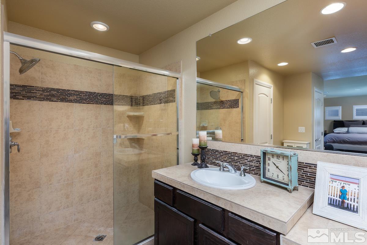 10701 Cordero Drive Reno, NV 89521 - Photo 18 of 25 a bathroom with a sink and a mirror