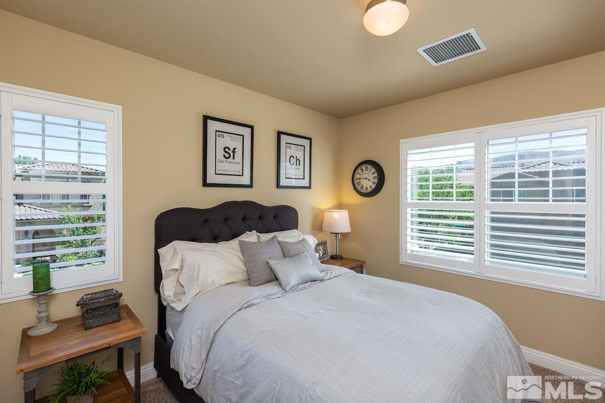 10701 Cordero Drive Reno, NV 89521 - Photo 22 of 25 a bedroom with a bed and a large window