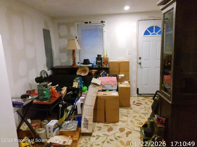 a room with furniture a rug and a closet