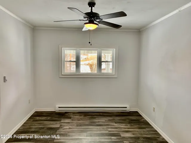 a view of room with window and ceiling fan