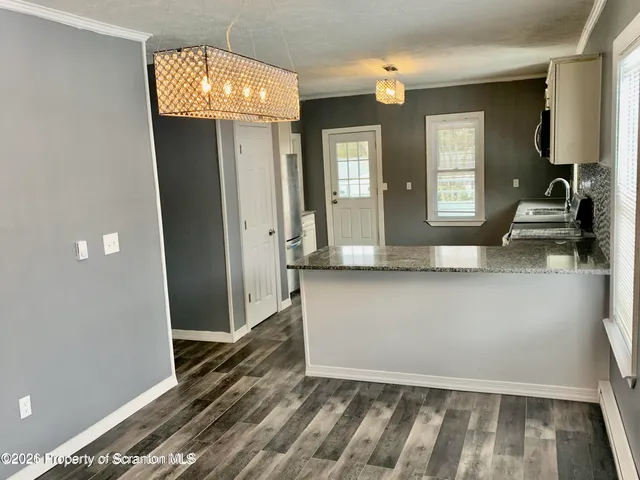 wooden floor with a window in a room