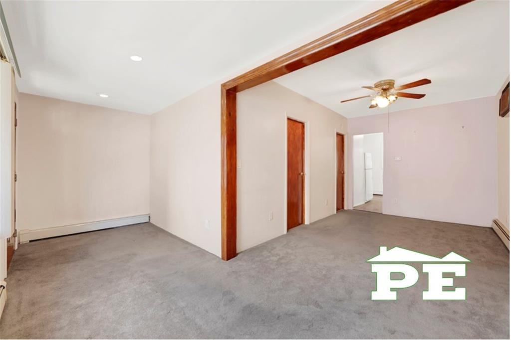 23 Bogardus Street Brooklyn, NY 11235 - Photo 12 of 21 an empty room with windows and fan