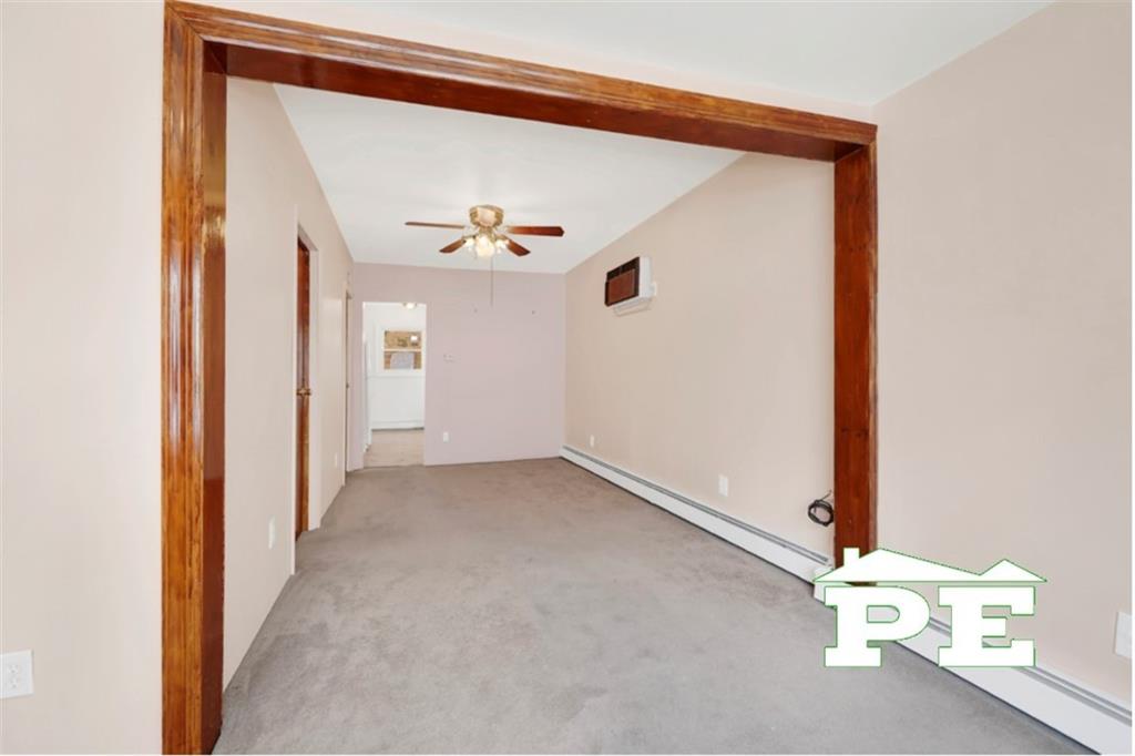 23 Bogardus Street Brooklyn, NY 11235 - Photo 13 of 21 a view of a room with wooden floor and windows