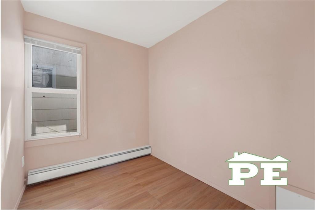 23 Bogardus Street Brooklyn, NY 11235 - Photo 15 of 21 a view of an empty room and window