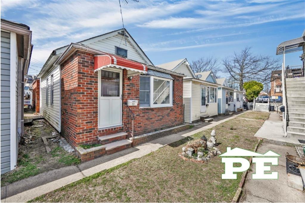 23 Bogardus Street Brooklyn, NY 11235 - Photo 17 of 21 a front view of a house with a yard