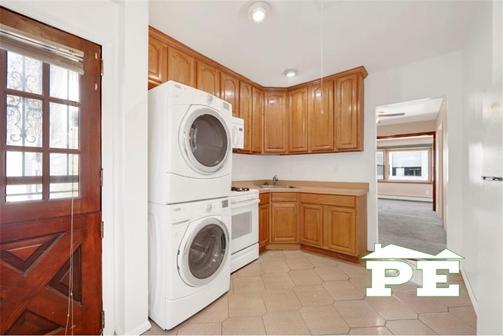 23 Bogardus Street Brooklyn, NY 11235 - Photo 2 of 21 a view of a kitchen with washer and dryer