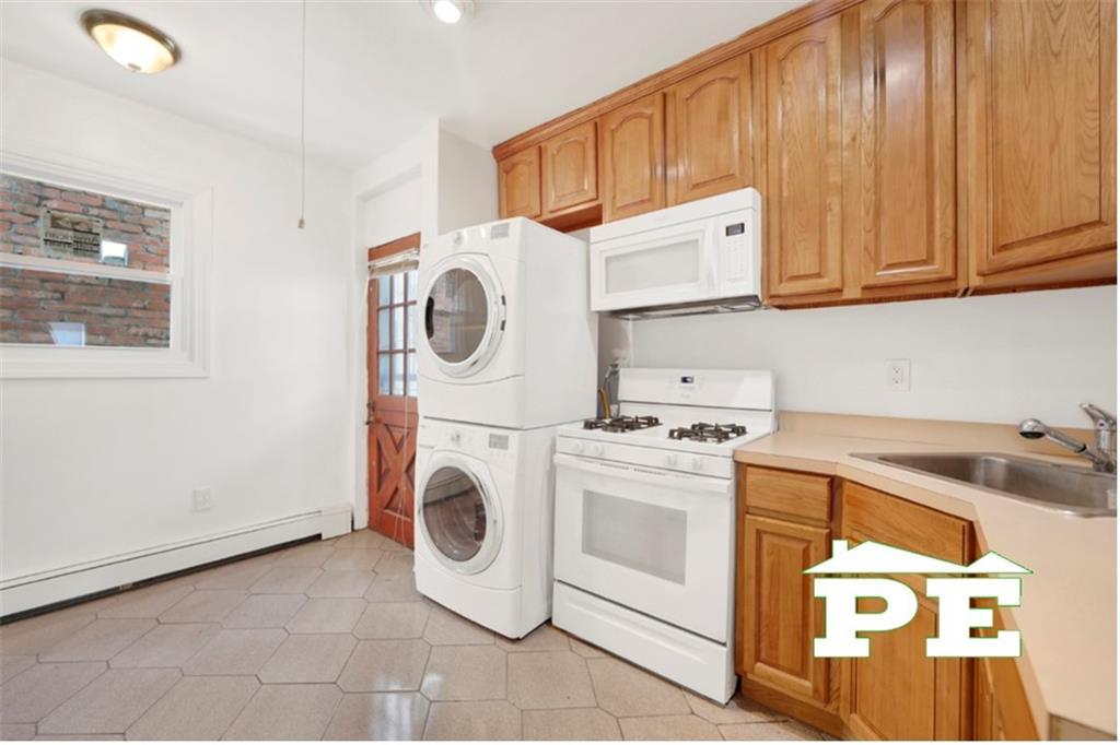 23 Bogardus Street Brooklyn, NY 11235 - Photo 3 of 21 a utility room with dryer and washer