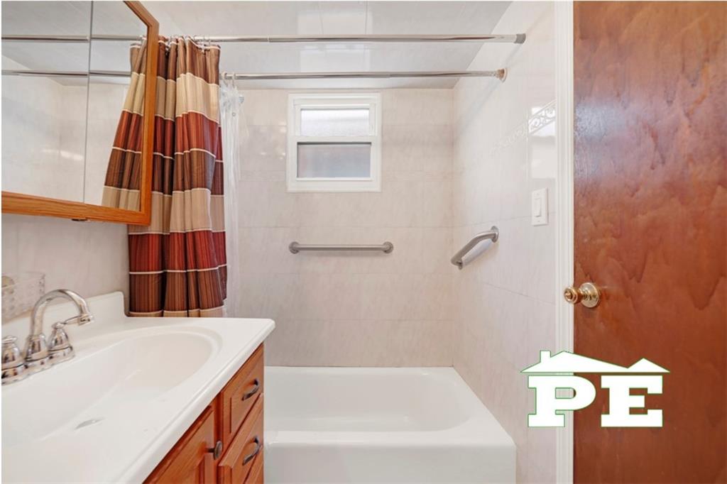 23 Bogardus Street Brooklyn, NY 11235 - Photo 5 of 21 a bathroom with a sink and a bathtub