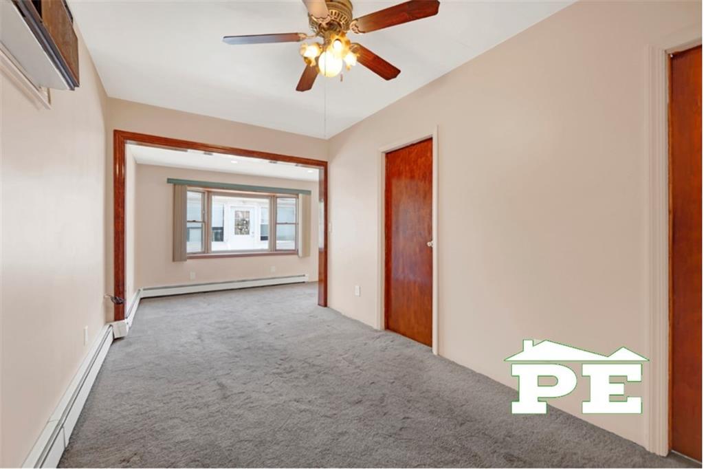 23 Bogardus Street Brooklyn, NY 11235 - Photo 7 of 21 a view of a room with a ceiling fan and a window