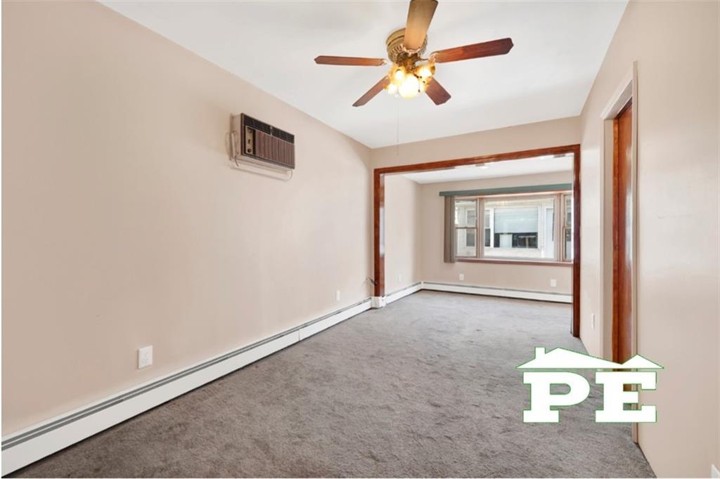 23 Bogardus Street Brooklyn, NY 11235 - Photo 8 of 21 an empty room with a window and a ceiling fan