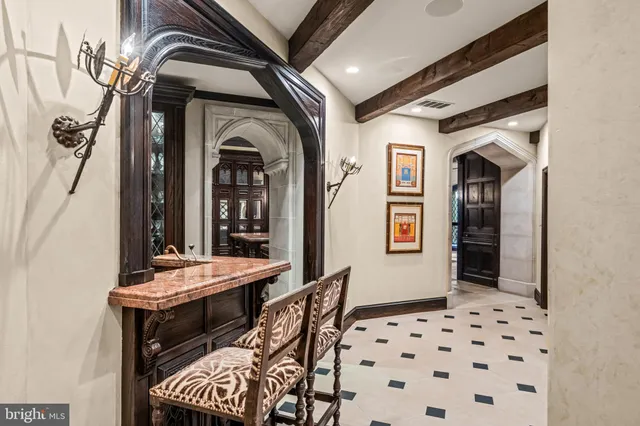 a view of a hallway with entryway and furniture