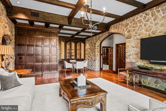 a dining room with furniture and wooden floor