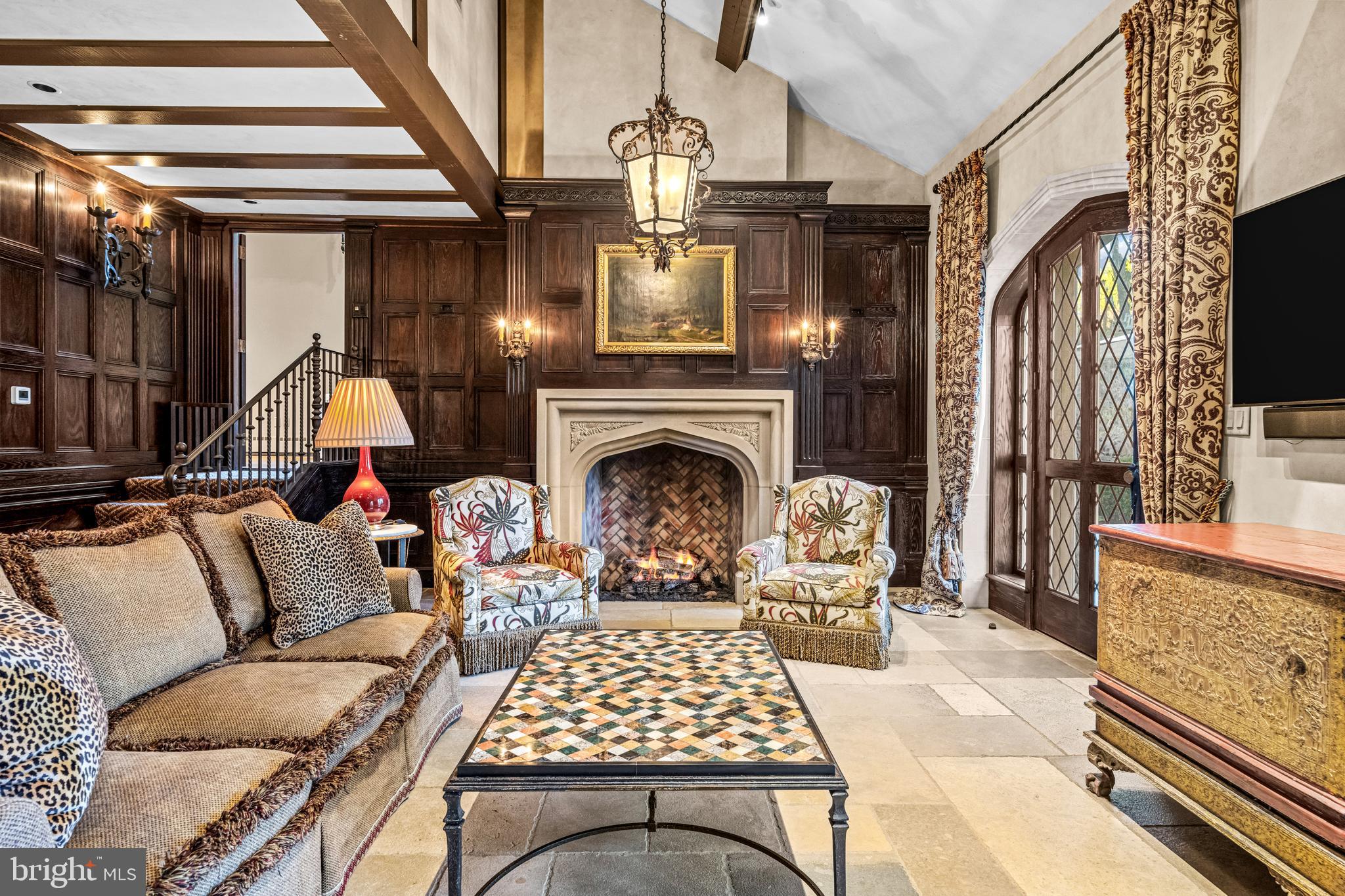 56 Crosby Brown Road Gladwyne, PA 19035 - Photo 25 of 51 a living room with furniture a fireplace and a chandelier