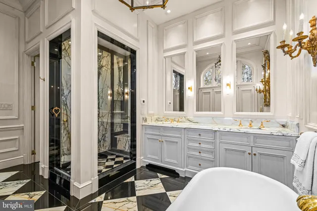 a bathroom with a double vanity sink a mirror and a shower