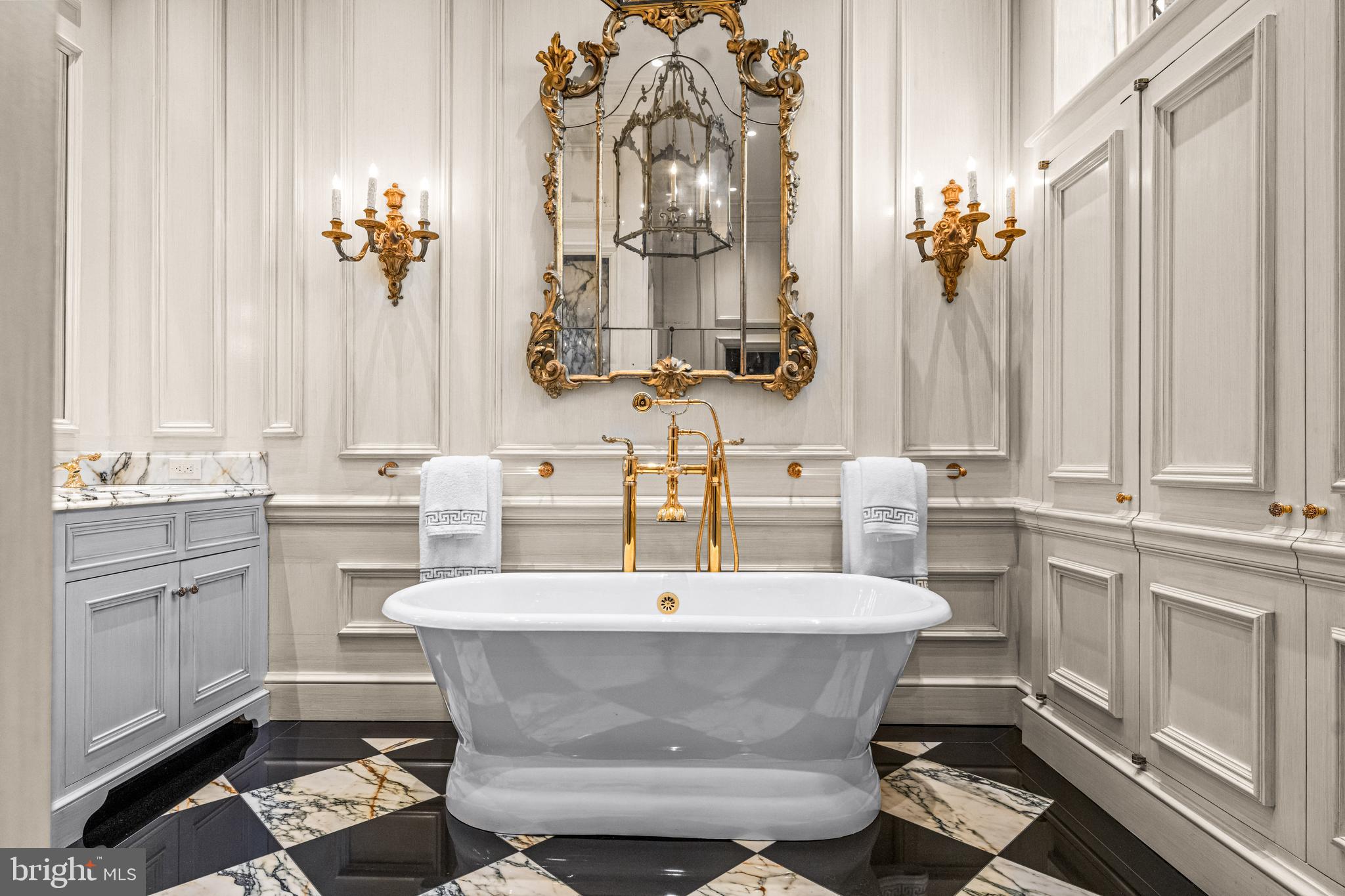 56 Crosby Brown Road Gladwyne, PA 19035 - Photo 32 of 51 a dining room with stainless steel appliances a sink and a chandelier