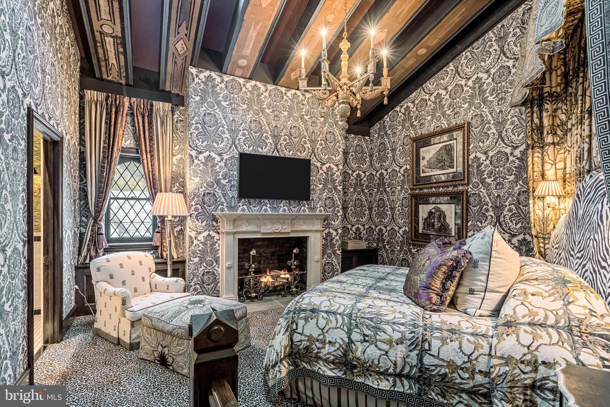 56 Crosby Brown Road Gladwyne, PA 19035 - Photo 38 of 51 a living room with furniture a fireplace and a flat screen tv