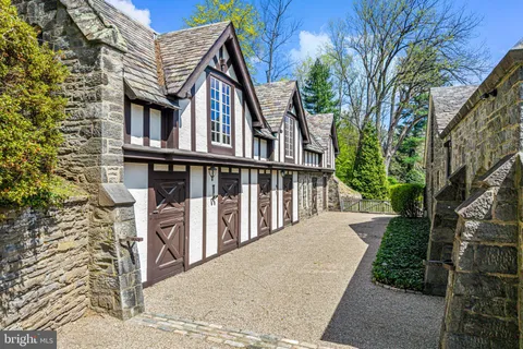 a bedroom with furniture and a wooden floor