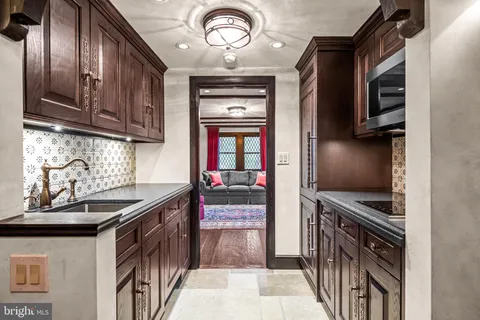 a living room with furniture a couch and a window