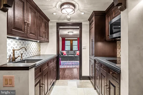 a living room with furniture a couch and a window